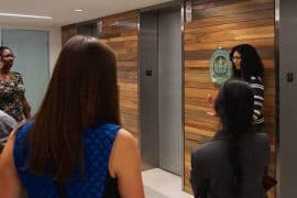 Professionals talking in lobby of U.S. Green Building Council headquarters - 2030 Challenge