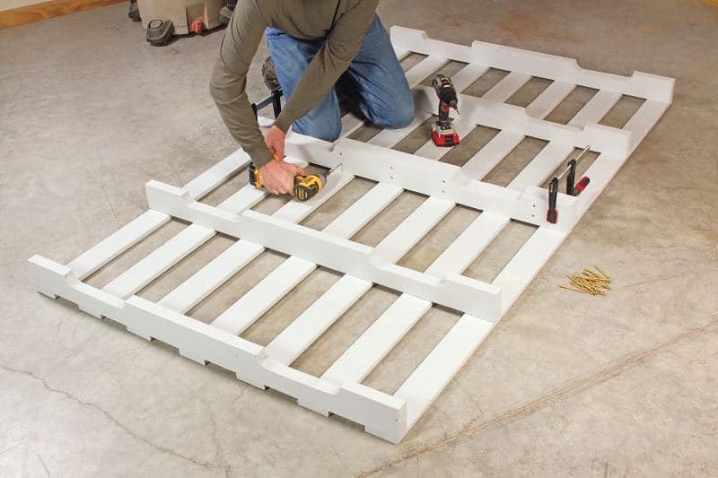Builder fastening two pallets together - DIY platform bed