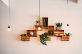 Recycled crates hanging from wall as shelving - Green lighting
