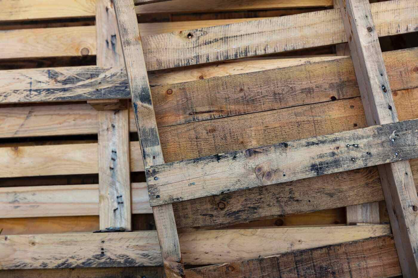 close up of pallets - green building - things to consider before hiring a contractor