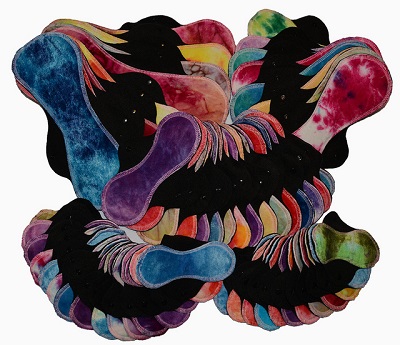 A bunch of different-colored cloth pads. Photo via Wikimedia Commons.