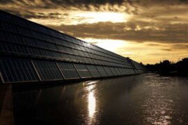 solar panels over water - coal takes a back seat to green energy