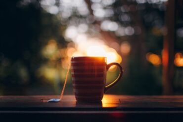 mug of tea on windowsill at sunset - tips on designing a safe and comfortable home