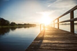 sunrise over lake - guide to floating dock systems