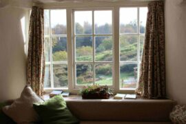 window looking onto green countryside - small changes to make your home energy efficient