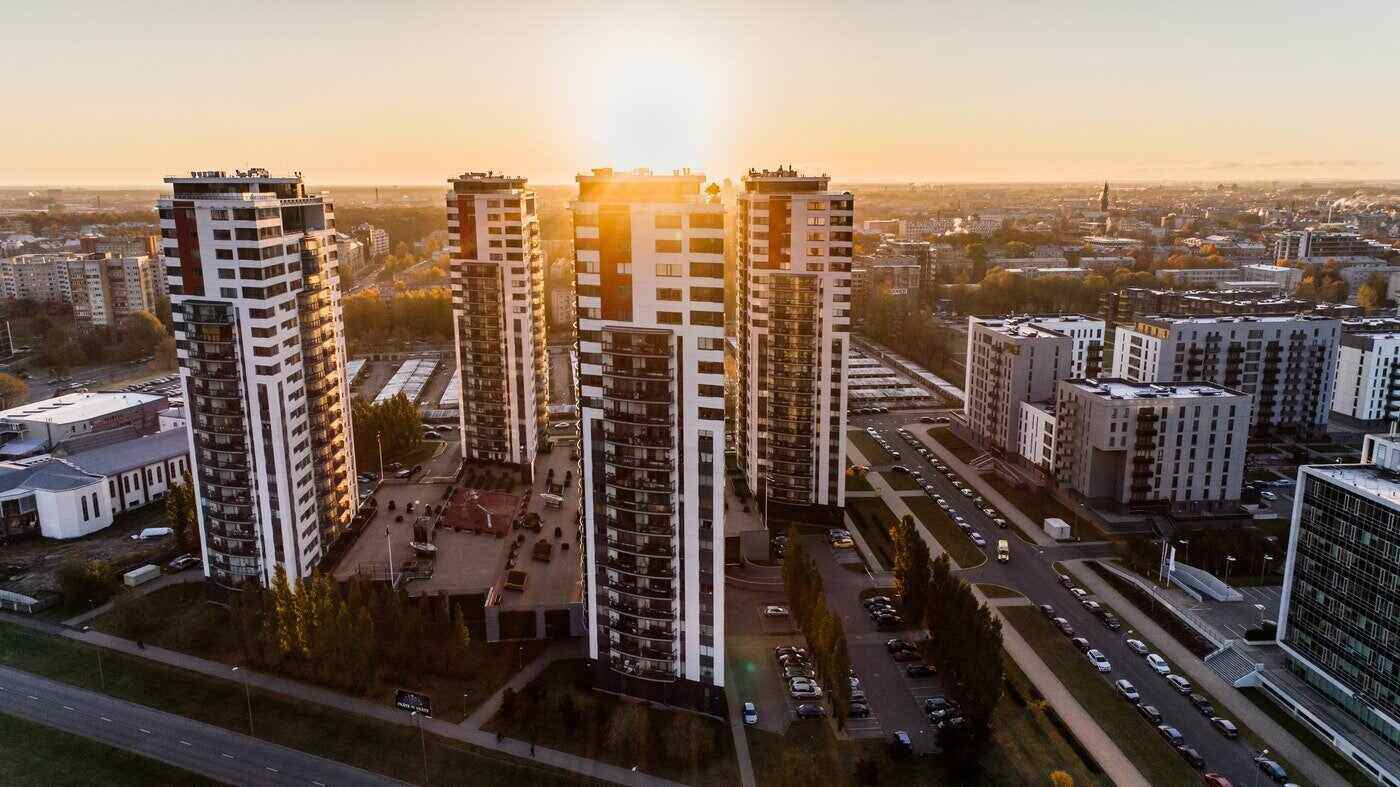 apartment buildings at sunset - green real estate trends 2021