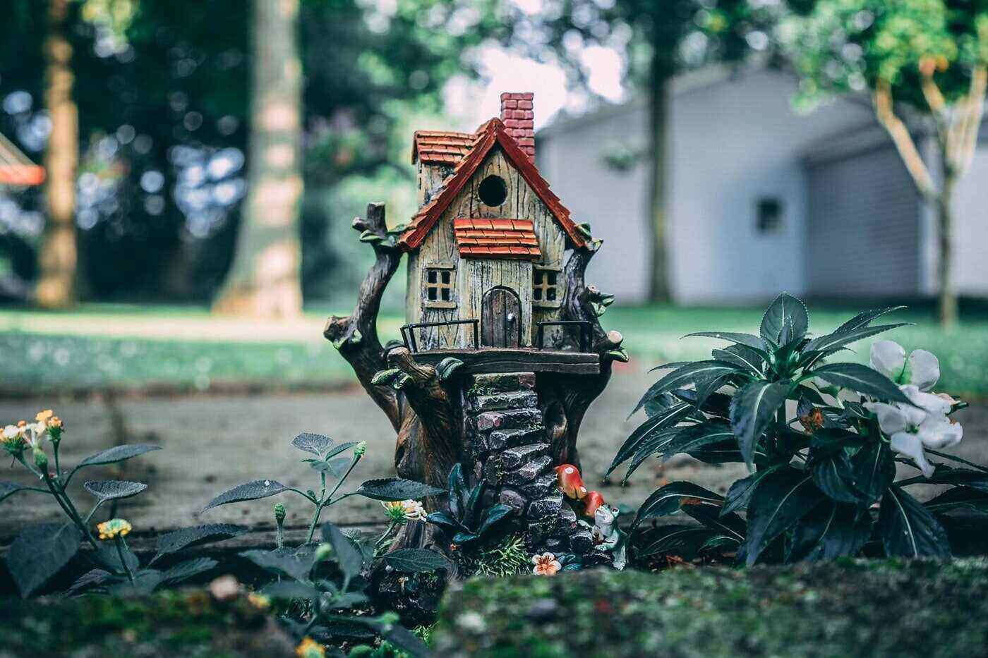 birdhouse in the shape of a house - is it greener to build or buy a house