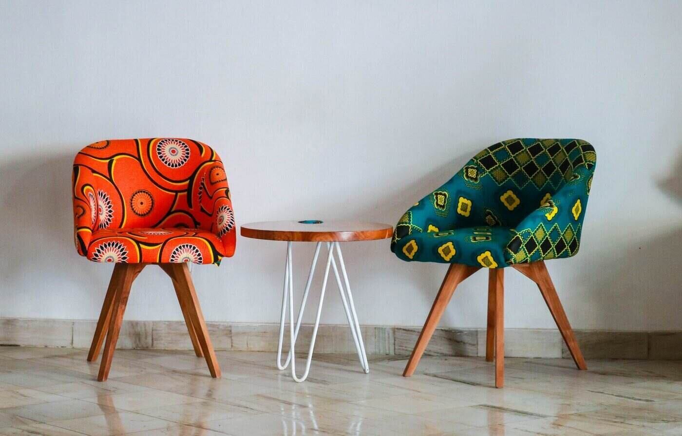 two upholstered chairs next to a table - minimize your household waste