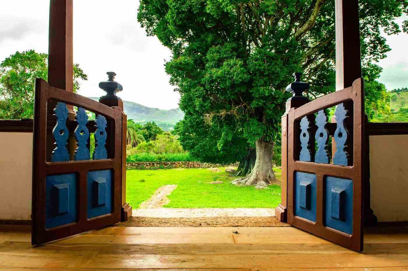open gate from porch leading to yard - sustainable home design that nourishes body and mind