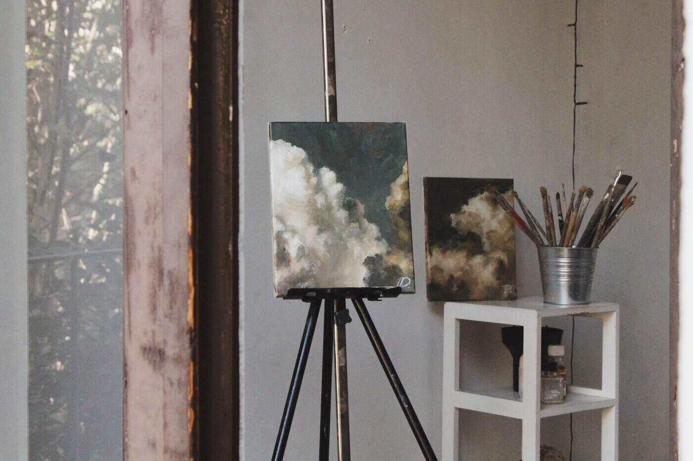 art studio corner with cloud paintings and brushes - 8 ways to use garden pods