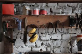 tools hanging on board in garage - essential tools for DIY projects