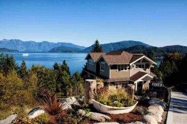 house on hill overlooking lake - transform your home into an eco-friendly space
