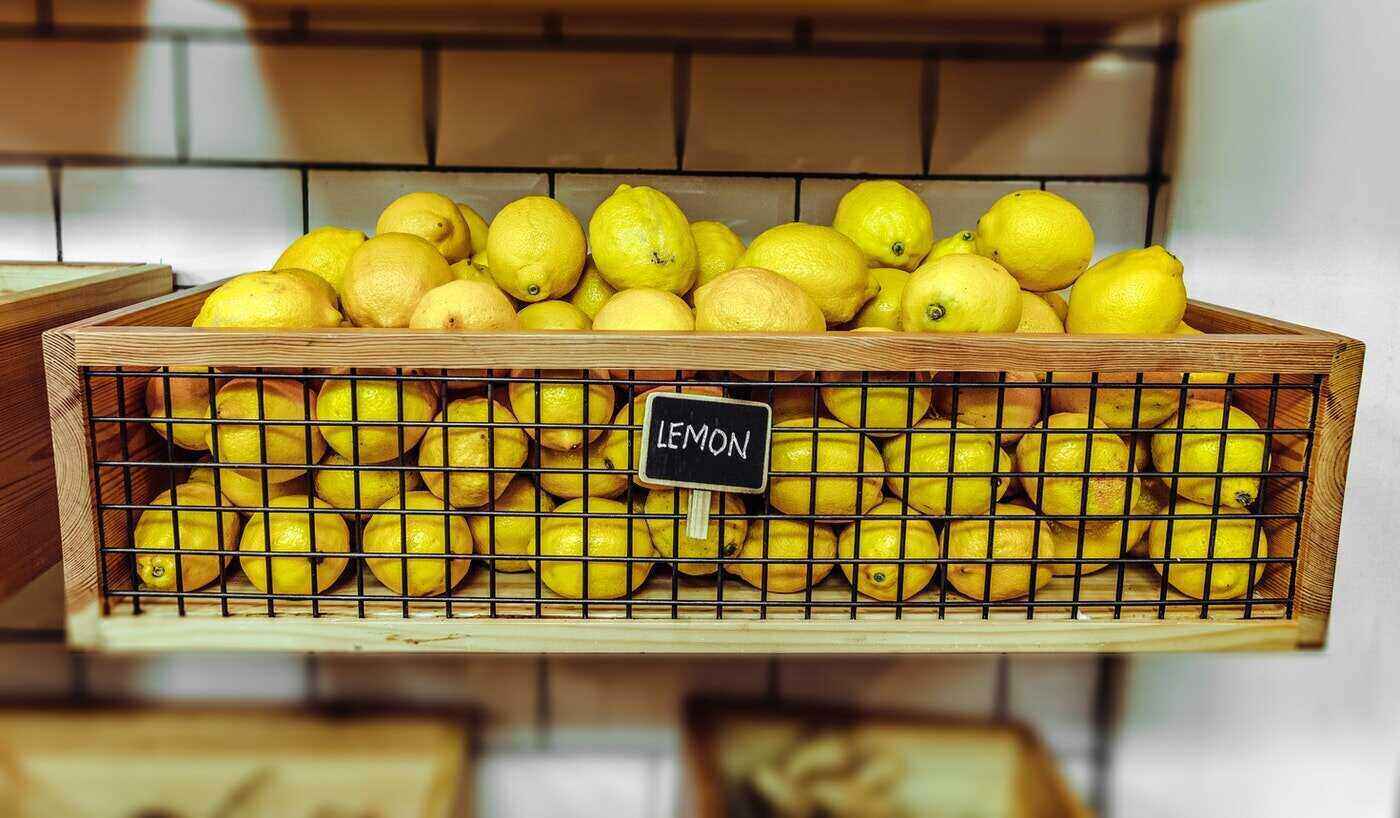 lemons in crate with sign - tips for cleaning your house the eco-friendly way