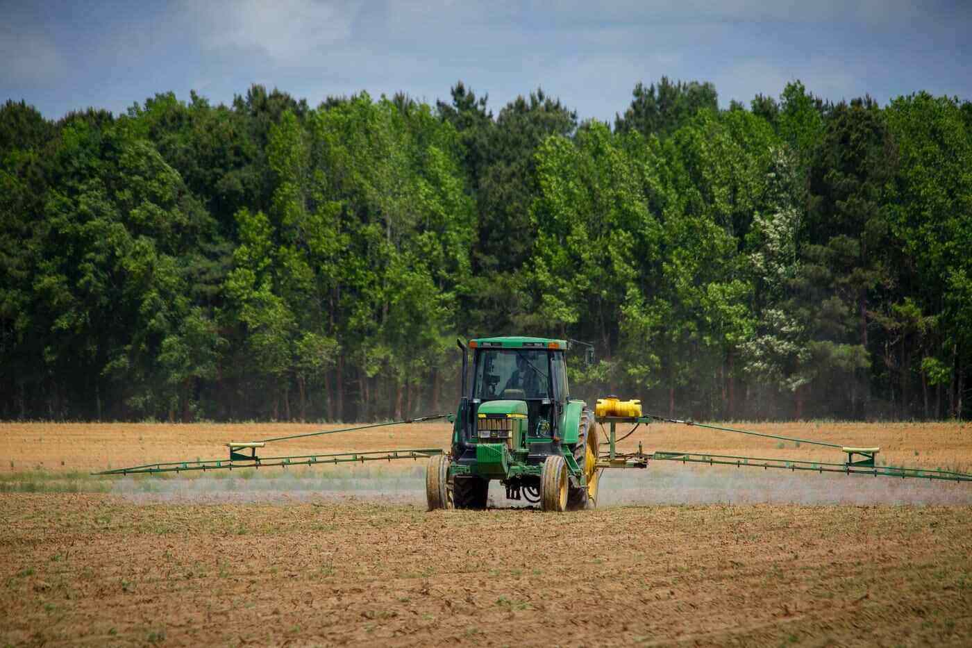 tractor spraying crop - the not-so-secret dangers of paraquat and how it affects you