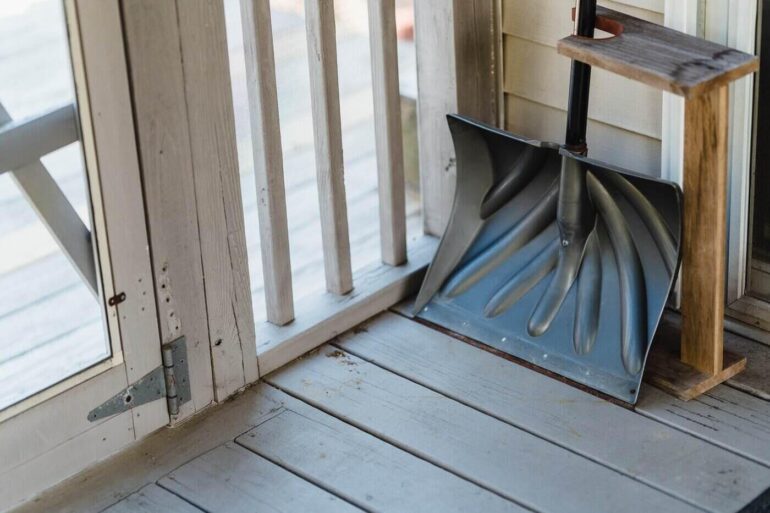 snow shovel by door - best insulation to use when insulating floors