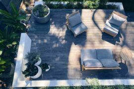 top view of deck with planters and furniture - create a tranquil and private backyard for you and your family