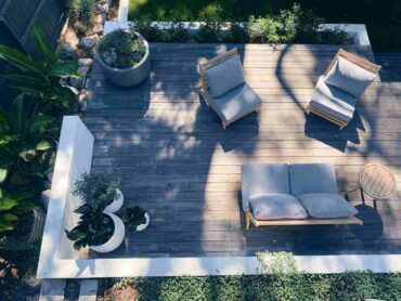 top view of deck with planters and furniture - create a tranquil and private backyard for you and your family