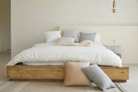 bed with white duvet and pillows - why you should switch to an organic mattress