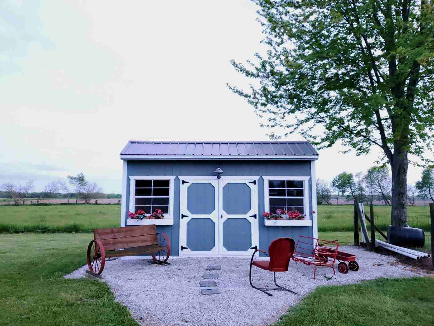 beautiful shed with flowers - 7 smart ways to use a backyard shed