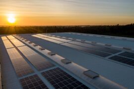 solar panels on roof at sunrise - solar safety issues and how to avoid them