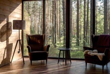 pair of armchairs by window - best prefab homes under 100k